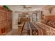 This bedroom has a wooden frame bed with a patterned quilt, wardrobe, and access to the backyard at 15256 N 62Nd Ave, Glendale, AZ 85306