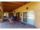 Cozy covered patio area with comfortable seating, perfect for outdoor relaxation and entertaining at 15256 N 62Nd Ave, Glendale, AZ 85306