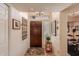 Inviting home foyer with a dark wood door, neutral walls, and tile flooring, creating a warm and welcoming entrance at 15256 N 62Nd Ave, Glendale, AZ 85306