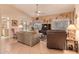 Comfortable living room with tiled floors, ceiling fan and view of the landscaped backyard at 15256 N 62Nd Ave, Glendale, AZ 85306