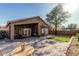 Expansive backyard with a covered patio and ample seating, blending indoor comfort with outdoor enjoyment at 16242 W Maui Ln, Surprise, AZ 85379
