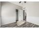 Bright bedroom with grey wood-look flooring, and a closet at 16242 W Maui Ln, Surprise, AZ 85379