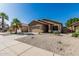 Charming single-story house with a well-manicured lawn, desert landscaping, and a two-car garage at 16242 W Maui Ln, Surprise, AZ 85379