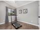 Spare bedroom with a treadmill and window providing ample sunlight at 16365 N 138Th Ave, Surprise, AZ 85374
