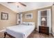 Relaxing bedroom featuring ceiling fan, wood floors, and natural light at 16365 N 138Th Ave, Surprise, AZ 85374