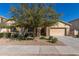 Charming single-Gathering home with desert landscaping, stone accents, and a two-car garage at 16758 W Apache St, Goodyear, AZ 85338