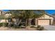 Charming single-Gathering home with desert landscaping, stone accents, and a two-car garage at 16758 W Apache St, Goodyear, AZ 85338