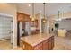 Modern kitchen featuring granite countertops, wood cabinets and stainless steel appliances at 16758 W Apache St, Goodyear, AZ 85338