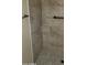 Modern tiled shower with bronze fixtures at 16758 W Apache St, Goodyear, AZ 85338