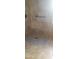 Tiled shower stall with tile flooring and bronze shower fixture and matching assist bar at 16758 W Apache St, Goodyear, AZ 85338