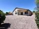 Expansive backyard with low-maintenance rock landscaping and a covered patio at 1679 E Oakland St, Gilbert, AZ 85295