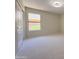 Bedroom showcasing neutral walls, carpet flooring and large window at 1679 E Oakland St, Gilbert, AZ 85295