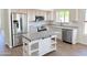 Bright kitchen featuring stainless steel appliances, an island, and granite countertops at 1679 E Oakland St, Gilbert, AZ 85295