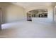 Expansive living room showcasing vaulted ceilings and open layout into dining and kitchen areas at 1679 E Oakland St, Gilbert, AZ 85295