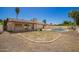 Wide shot of the backyard showcasing a pool and ample open space at 17244 N 36Th Ln, Glendale, AZ 85308