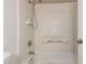 Bathroom showcasing tiled shower and tub with chrome fixtures and built in niches at 17244 N 36Th Ln, Glendale, AZ 85308