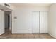 Bedroom with tile flooring, closet, and access to hallway and another room at 17244 N 36Th Ln, Glendale, AZ 85308