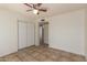 Comfortable bedroom boasts tile flooring and a double-door closet for ample storage at 17244 N 36Th Ln, Glendale, AZ 85308