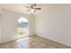 Well-lit bedroom featuring tile floors and a window providing a view of the outdoors at 17244 N 36Th Ln, Glendale, AZ 85308