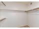 Walk-in closet with shelving and wood rods at 17244 N 36Th Ln, Glendale, AZ 85308