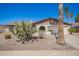 Charming single story home featuring desert landscaping, a two-car garage and arched entryway windows at 17244 N 36Th Ln, Glendale, AZ 85308