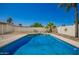 Backyard pool area with white fence, mature palms and easy access at 17244 N 36Th Ln, Glendale, AZ 85308