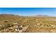 Sprawling desert landscape aerial view with single Gathering homes dotted among the desert landscape and mountain vistas at 1753 N Berrett --, Mesa, AZ 85207