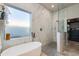 Stunning bathroom featuring a soaking tub, glass shower and luxurious marble accents throughout at 1753 N Berrett --, Mesa, AZ 85207
