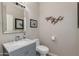 Charming powder room featuring a stylish vanity, toilet, and decorative accents at 1753 N Berrett --, Mesa, AZ 85207