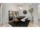 Well lit Dining room with an oval table, area rug, and decorative lighting and mirrors at 1753 N Berrett --, Mesa, AZ 85207