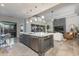 Kitchen and living area with a large central island, modern lighting, and stylish furniture at 1753 N Berrett --, Mesa, AZ 85207