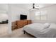 Comfortable bedroom with carpet, television and a window for natural light at 17864 W Fetlock Trl, Surprise, AZ 85387