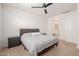 Bedroom featuring carpet, neutral color palette and ensuite bathroom access at 17864 W Fetlock Trl, Surprise, AZ 85387