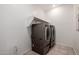 A modern laundry room featuring front-loading washer and dryer units with clean and bright space at 17864 W Fetlock Trl, Surprise, AZ 85387