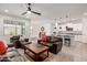 Spacious living room seamlessly flows into a modern kitchen, perfect for entertaining at 17864 W Fetlock Trl, Surprise, AZ 85387