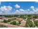 Beautiful aerial shot of a home with mature trees and landscaping in a quiet neighborhood on a bright day at 18132 E Vencino St, Gilbert, AZ 85298