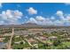 A picturesque aerial view of a neighborhood with homes featuring lush landscaping and mountain views at 18132 E Vencino St, Gilbert, AZ 85298