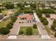 Aerial view showcasing the home's circular driveway and well-manicured front yard at 18132 E Vencino St, Gilbert, AZ 85298