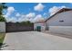 Private backyard features a full fence, gray driveway, and low maintenance landscape at 18132 E Vencino St, Gilbert, AZ 85298