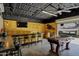 Entertain in style with this rustic bar area and a foosball table, perfect for gatherings at 18132 E Vencino St, Gilbert, AZ 85298