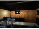 Relaxing bar with multiple seating areas, flat screen tv and industrial lighting is a perfect place to entertain at 18132 E Vencino St, Gilbert, AZ 85298