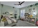 Charming bedroom with playful decor, neutral walls, and modern ceiling fan at 18132 E Vencino St, Gilbert, AZ 85298