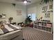 Bright bedroom with charming decor and a window allowing natural light at 18132 E Vencino St, Gilbert, AZ 85298
