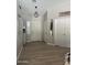 An entryway with a white front door, light gray walls, and tile floors at 18132 E Vencino St, Gilbert, AZ 85298