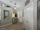 Welcoming entryway with unique decor, lighting fixture, and easy access to all rooms at 18132 E Vencino St, Gilbert, AZ 85298