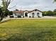 Charming single-story home with lush front lawn and a brick walkway at 18132 E Vencino St, Gilbert, AZ 85298