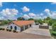 Charming home featuring a red tile roof, spacious driveway, and a manicured front yard on a sunny day at 18132 E Vencino St, Gilbert, AZ 85298