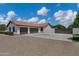 Exterior elevation shows a three-car garage with a red tile roof, paved driveway and gated entrance at 18132 E Vencino St, Gilbert, AZ 85298