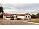 Inviting single-story home with red tile roof and well-manicured landscaping at 18132 E Vencino St, Gilbert, AZ 85298