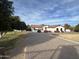 Charming single-story home featuring a brick driveway and desert landscaping at 18132 E Vencino St, Gilbert, AZ 85298